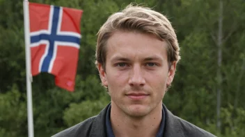 En person med etternavnet Ellefsen, med et norsk flagg i bakgrunnen