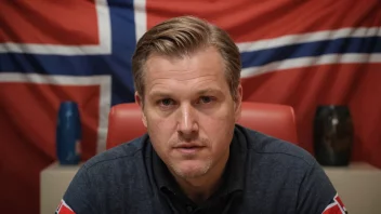 En person med etternavnet Torkildsen, med et norsk flagg i bakgrunnen